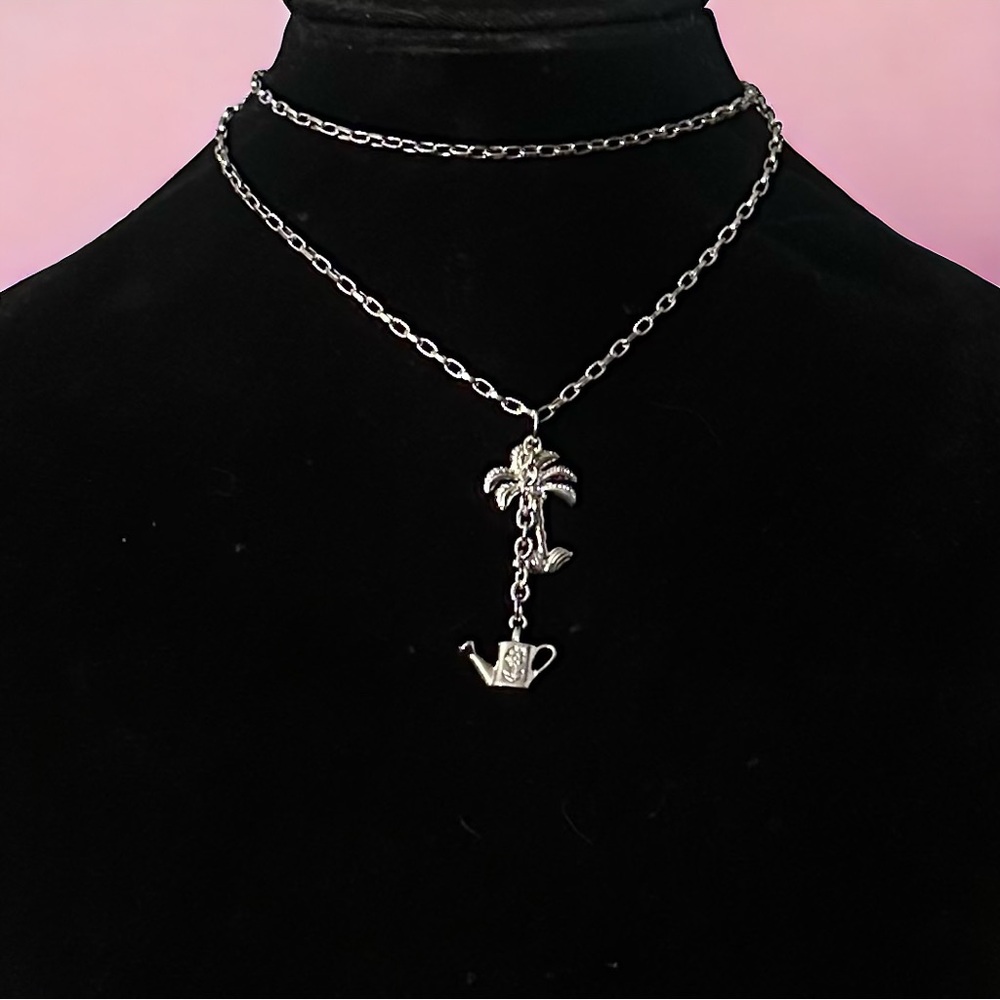 Bijoux Stella palm tree and watering can pendant necklace